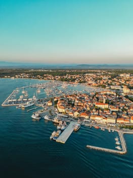 Biograd na Moru, aerial above view of luxury yachts and ships in port, waterfront historic buildings of Old Town. Beautiful destination for travel on Adriatic Sea coast, Dalmatia region of Croatia