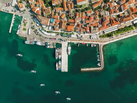 Biograd na Moru, aerial above view of city port with beautiful architecture and sailing boats and luxury yachts at stone pier. Scenic historic harbor on Adriatic Sea coast, Dalmatia region in Croatia
