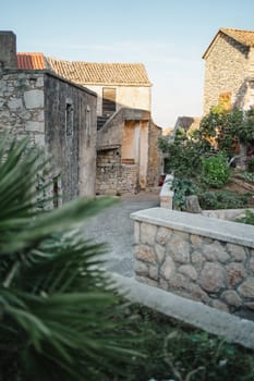 Narrow medieval street with stone houses in Old Town, Biograd na Moru in Croatia