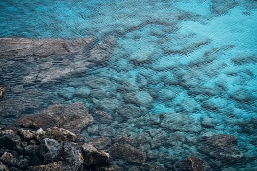 Top view of stones and rocks underwater, rocky sea beach in Cape Greco National Park, Cyprus