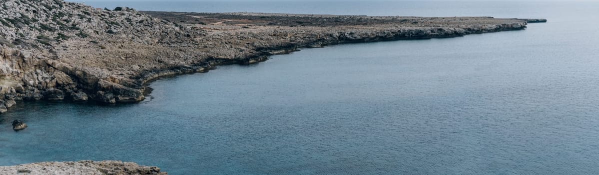 Panoramic landscape with rocks and calm blue sea in Cape Greco National Park, Cyprus