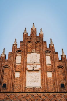 Corpus Christi Basilica red brick facade, Gothic church and landmark in Krakow, Poland