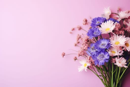 Pink horizontal background with a bouquet of field flowers.