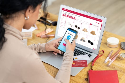 Woman shopping online on internet marketplace browsing for sale items for modern lifestyle and use credit card for online payment from wallet protected by crucial cyber security software