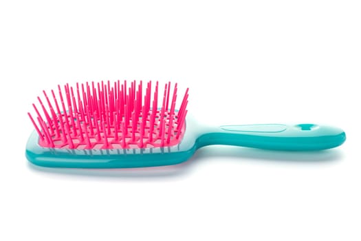 Plastic hairbrush isolated on white background. Colored comb on white background.