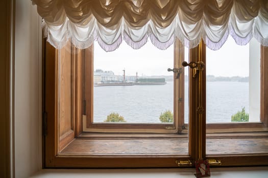 View from the window of the Hermitage on the arrow with the Rastral columns of St. Petersburg. photo