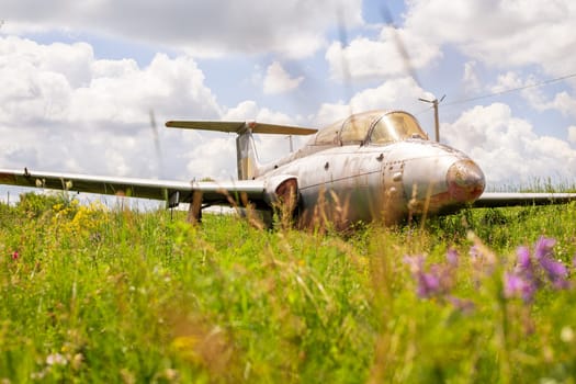 Old abandoned airfield with abandoned planes. Abandoned rusty old planes on the grass