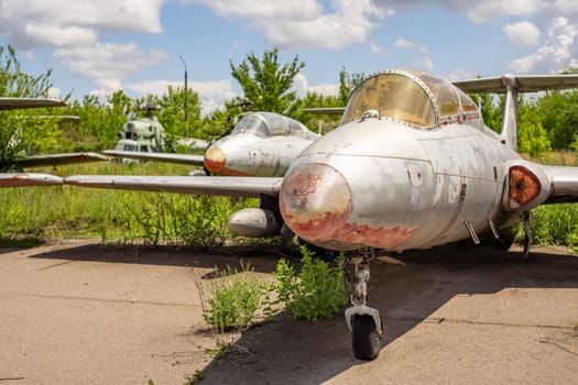 Old abandoned airfield with abandoned planes. Abandoned rusty old planes on the grass