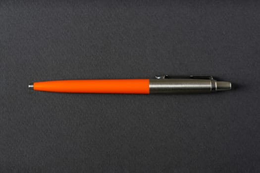 Close up of a vintage style Ballpoint pen on a dark gray background