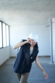 Shot of young woman dancing in style of hip hop in parking garage.