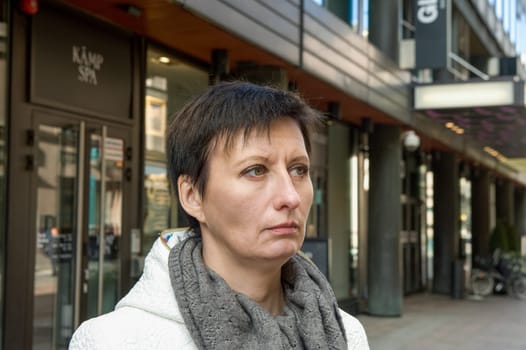 portrait of a woman in a white jacket in Helsinki