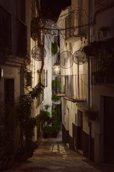 Calle Adentro at night. The most beautiful and famous street in the city of Quesada in the province of Jaen. Travel and tourism concept