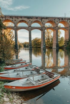 Railway Bridge with river in Bietigheim-Bissingen, Germany. Autumn. Railway viaduct over the Enz River, built in 1853 by Karl von Etzel on a sunny summer day. Bietigheim-Bissingen, Germany. Old viaduct in Bietigheim reflected in the river. Baden-Wurttemberg, Germany. Train passing a train bridge on a cloudy day in Germany