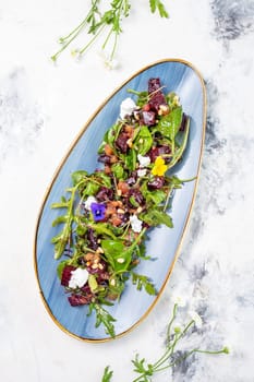 Wholesome and colorful salad of organic baby greens, roasted beets, creamy goat cheese, crunchy pistachios, and a light citrus dressing.
