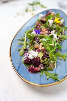 Wholesome and colorful salad of organic baby greens, roasted beets, creamy goat cheese, crunchy pistachios, and a light citrus dressing.