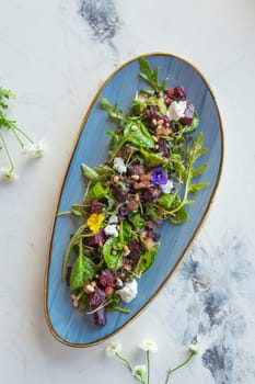 Wholesome and colorful salad of organic baby greens, roasted beets, creamy goat cheese, crunchy pistachios, and a light citrus dressing.