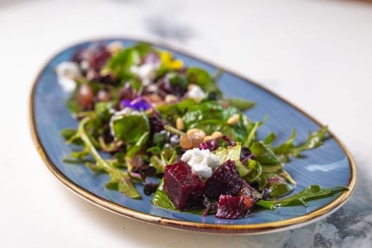 Wholesome and colorful salad of organic baby greens, roasted beets, creamy goat cheese, crunchy pistachios, and a light citrus dressing.