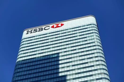 London, United Kingdom - February 03, 2019: Sun shines on world Headquarters of HSBC Holdings plc at 8 Canada Square, Canary Wharf. It is 7th largest bank worldwide, was established in 1865