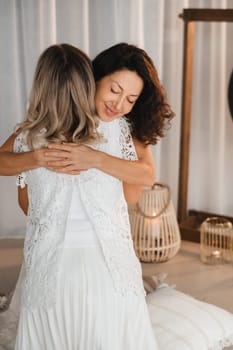 Two women hug at yoga. Women's Circle.