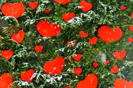 Vibrant red hearts are playfully scattered across the snowy landscape, creating a stunning contrast in colors and evoking a sense of warmth and joy.