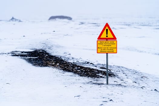 River flow growth traffic sign in Iceland in winter