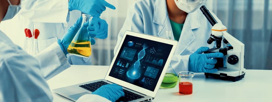 Laboratory research team advance healthcare with scientific expertise, laboratory equipment, and innovative medical biotechnology software, researching new medicines and developing cure.Panorama Rigid