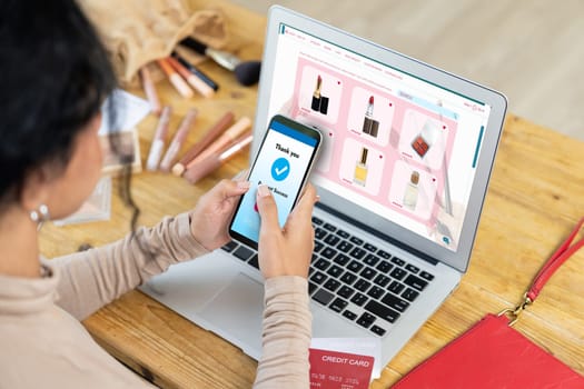 Woman shopping online on internet marketplace browsing for sale items for modern lifestyle and use credit card for online payment from wallet protected by crucial cyber security software