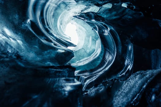 Gorgeous glacial crevasse in Iceland, Vatnajokull icelandic environment producing huge icy caverns with frozen composition. Inside the cave, clear glacial rocks and iced block routes.