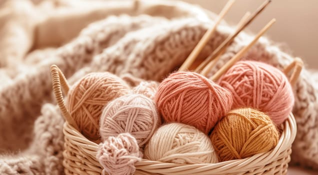 Yarn balls in a basket with knitting needles, warm tones. High quality photo