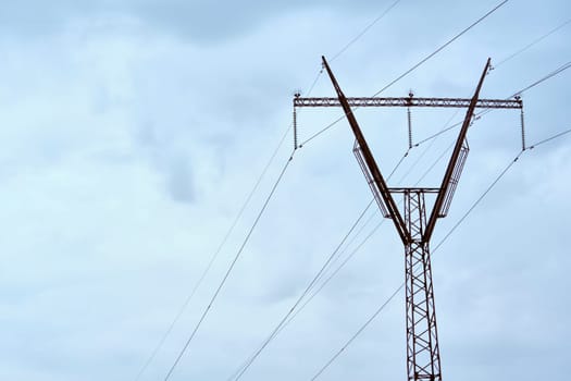 line of power lines against the blue sky