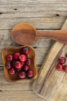 Rustic kitchen scene with fresh cranberries a symbol of health and wellness, often referred to as a superfood