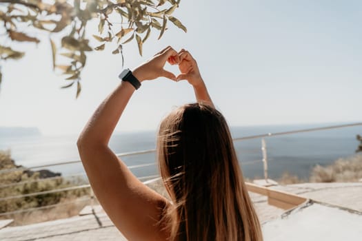 Fitness woman sea. Outdoor workout on yoga mat in park near to ocean beach. Female fitness pilates yoga routine concept. Healthy lifestyle. Happy fit woman exercising with rubber band in park.