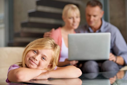 Smile portrait, child and parents in lounge with love, relax and laptop for streaming subscription on weekend. Father, mother and happy face of daughter with care and home to watch an online movie.