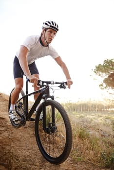 Man, bike and forest for nature, off road and cycling for health and wellness. Athlete, bicycle and training for workout, transportation and exercise with cape town mountain trail for fitness.