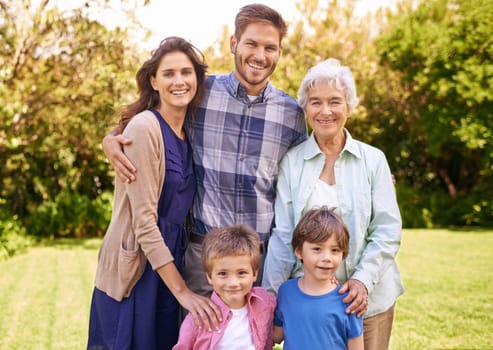 Family, outdoor and portrait for holiday, vacation and backyard with children and smile with love. Mom, dad and grandma with kids, nature and trees for memories, elderly and joy together in bonding.