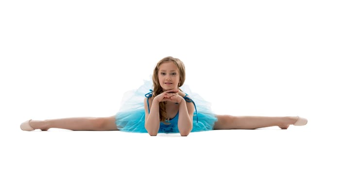 Adorable little girl posing in difficult stretching pose