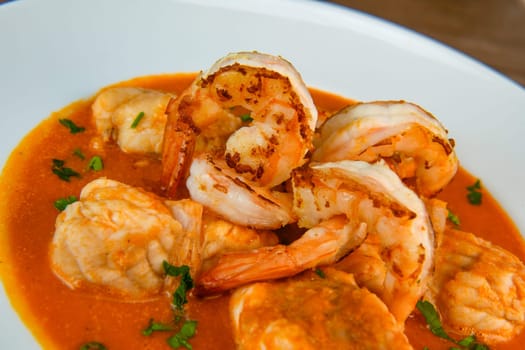 Recipe for Armorican-style monkfish tail, prawns, flambees with cognac, High quality photo