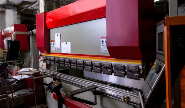 Image of semiautomatic bending machine in workshop