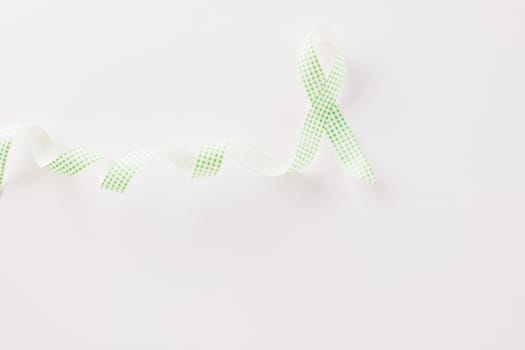 Green awareness ribbon of Gallbladder and Bile Duct Cancer month isolated on white background with copy space, concept of medical and health care support, Cancer awareness, World kidney day