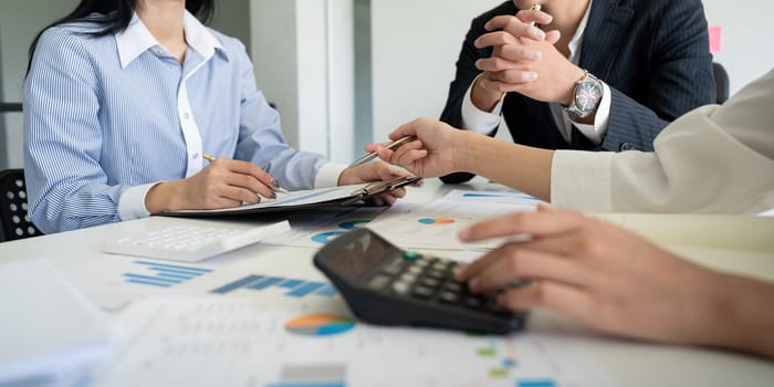 Business team analyzing income chart and graph in office. Close up. Business analysis and strategy concept.