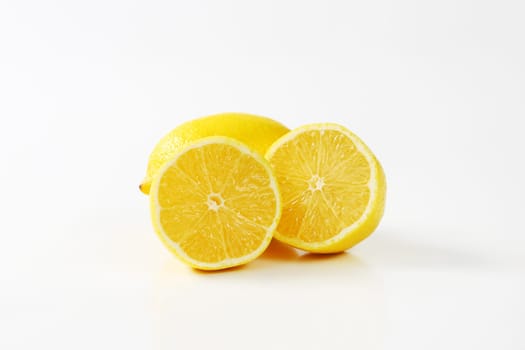 Fresh lemons - one whole and two halves