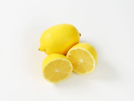 Fresh lemons - one whole and two halves