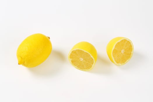 Fresh lemons - one whole and two halves
