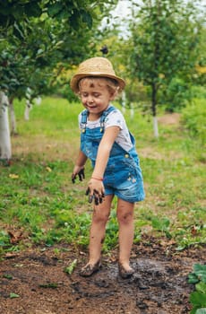 a child plants strawberries in the garden. Selective focus. nature.