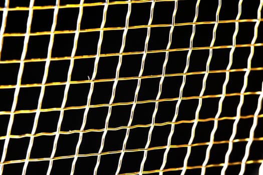 metal mesh on a black macro background