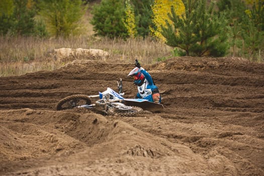 24 september 2016 - Volgsk, Russia, MX moto cross racing - motorcycle rider fell, telephoto