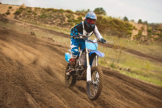 24 september 2016 - Volgsk, Russia, MX moto cross racing - Girl Bike Rider rides on a motorcycle, telephoto