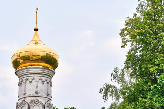 Russia-2020. Church domes of the Orthodox Church behind the trees. general plan. daylight