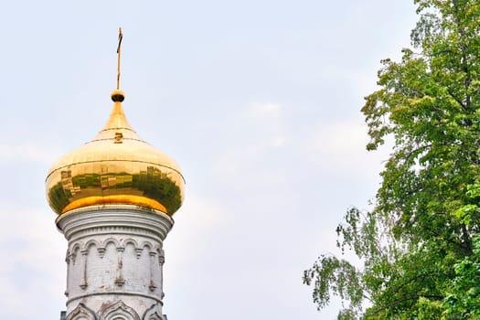 Russia-2020. Church domes of the Orthodox Church behind the trees. general plan. daylight