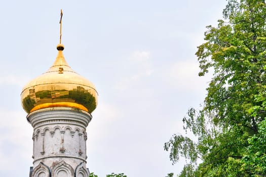 Russia-2020. Church domes of the Orthodox Church behind the trees. general plan. daylight